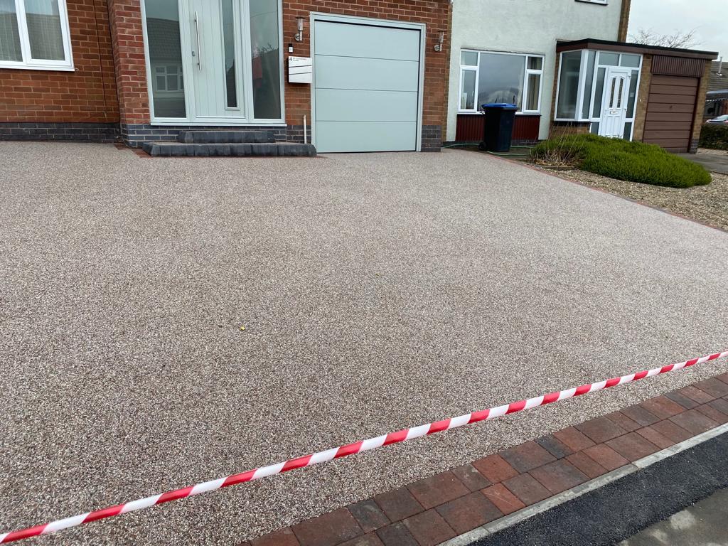 Resin bound driveway laid to a garage and front door